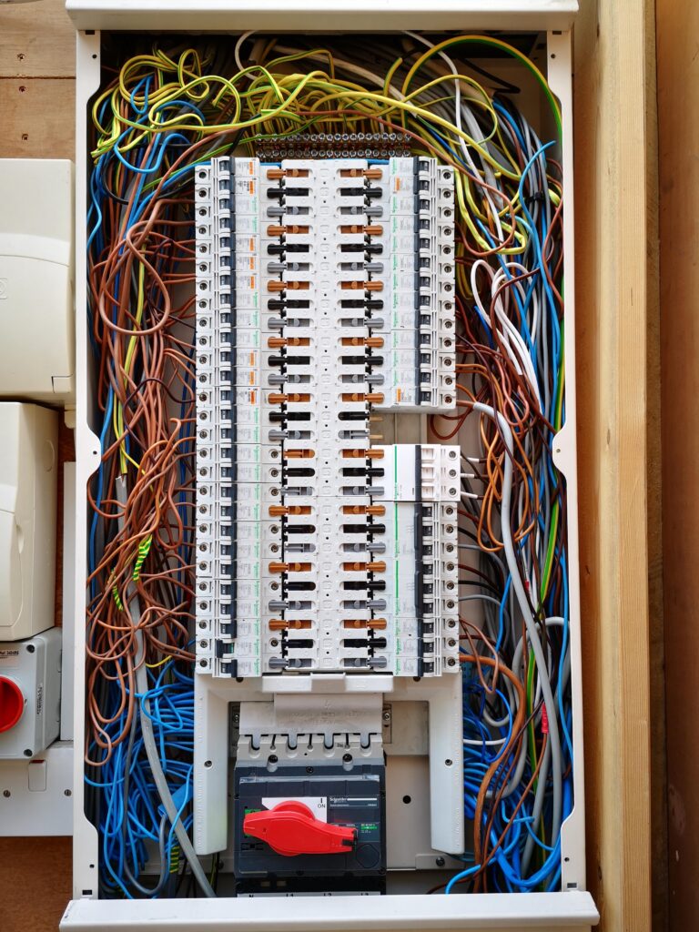 Electrical distribution board identified as non-compliant before upgrade during EICR inspection.