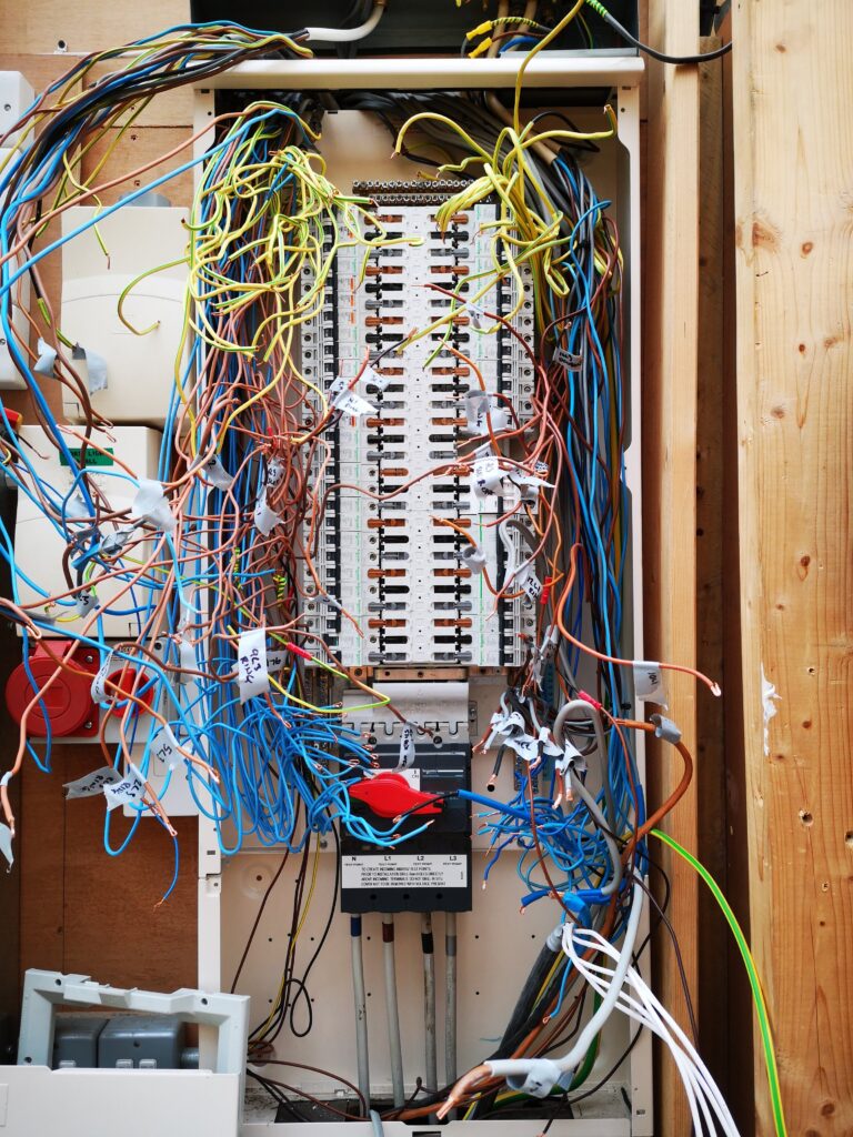 Electrical distribution board identified as non-compliant before upgrade during EICR inspection.