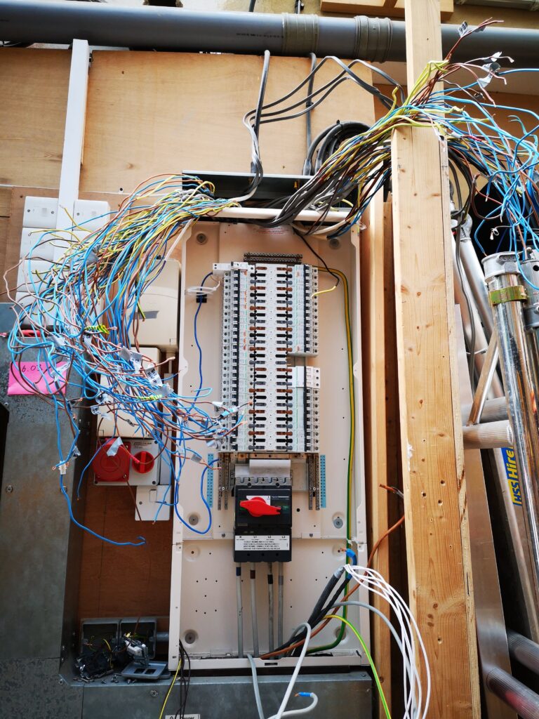 Electrical distribution board identified as non-compliant before upgrade during EICR inspection.