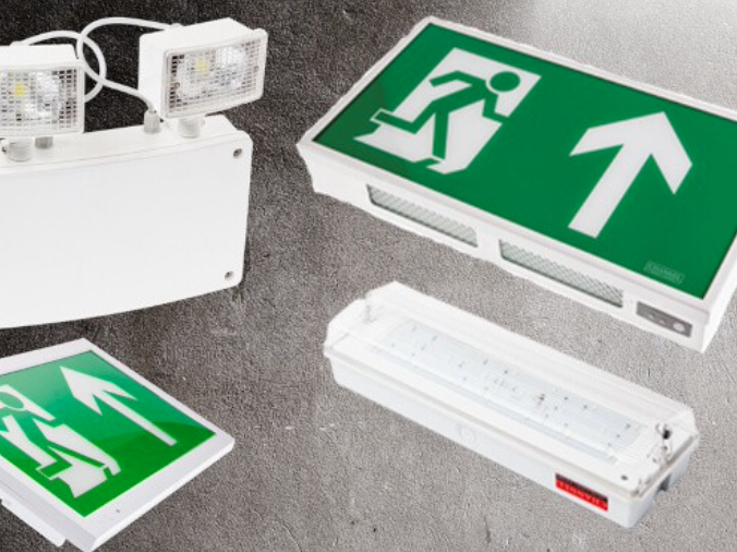 A green emergency exit sign with a running figure and arrow, indicating the direction to the nearest exit