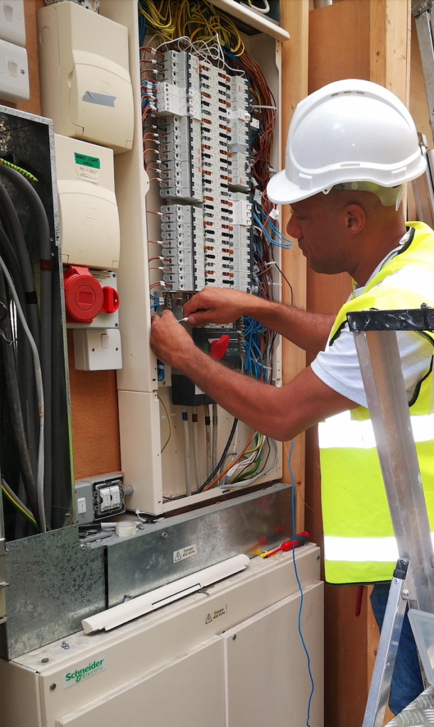 Electrical distribution board identified as non-compliant before upgrade during EICR inspection.