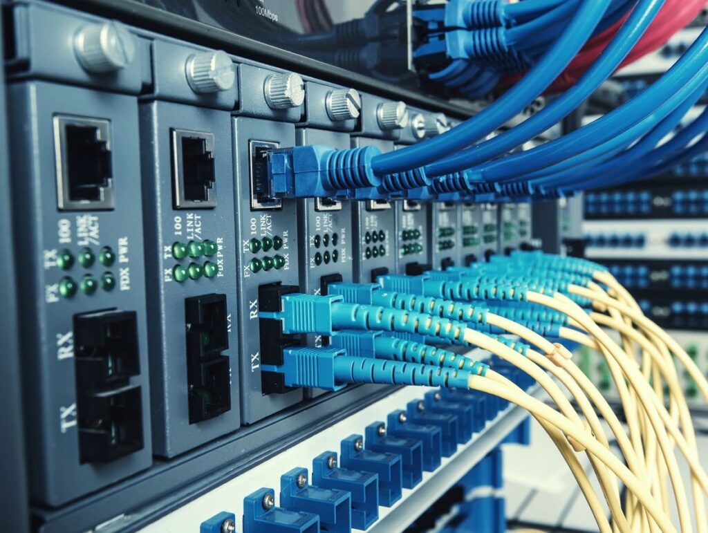 Optic fiber telecommunication equipment organized in a rack, ensuring efficient data transmission and network reliability.