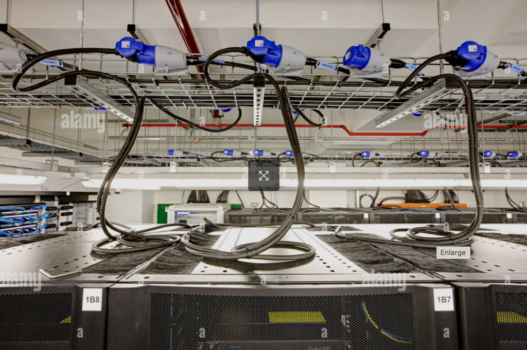 Installation of distribution equipment and power distribution units in a telecommunications room.